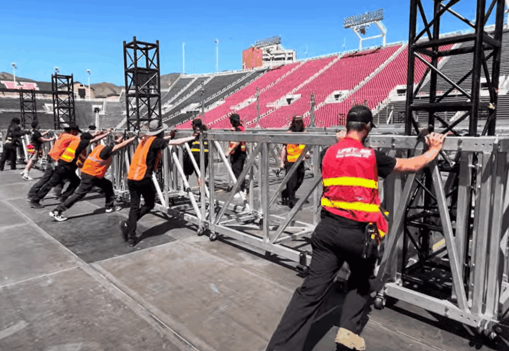 employees assembling a stage