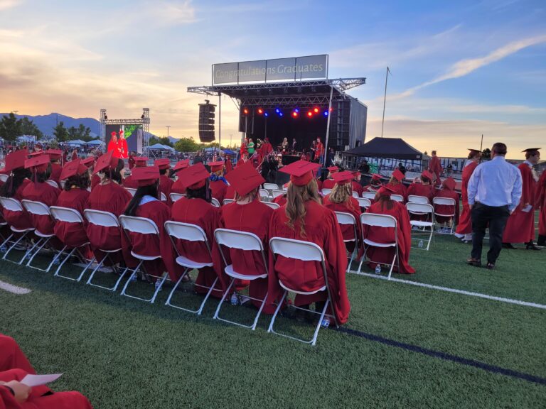 students watching graduation