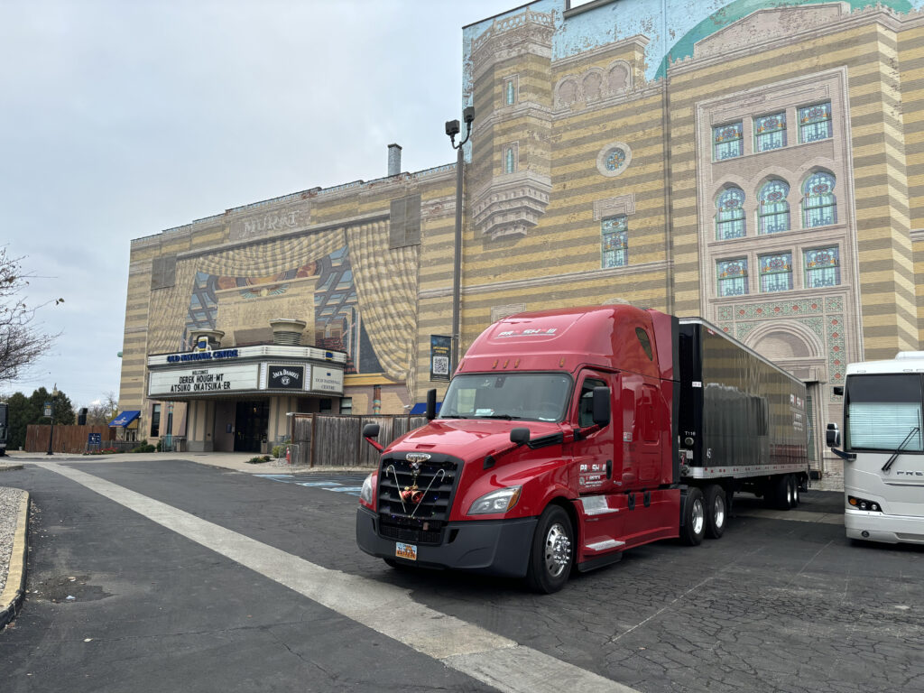 red semi-truck unloading equipment