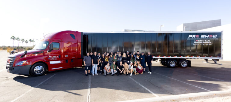 employees in front of semi-truck