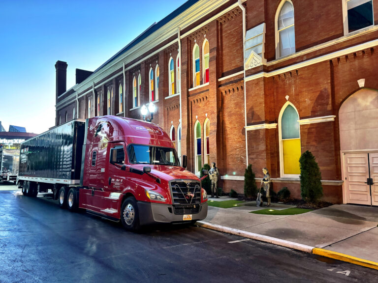 red semi-truck parked on the street