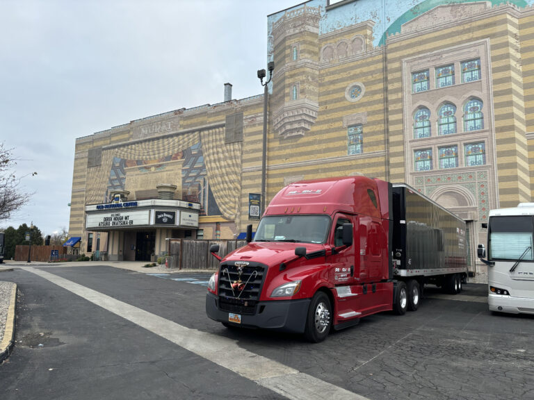 red semi-truck unloading equipment