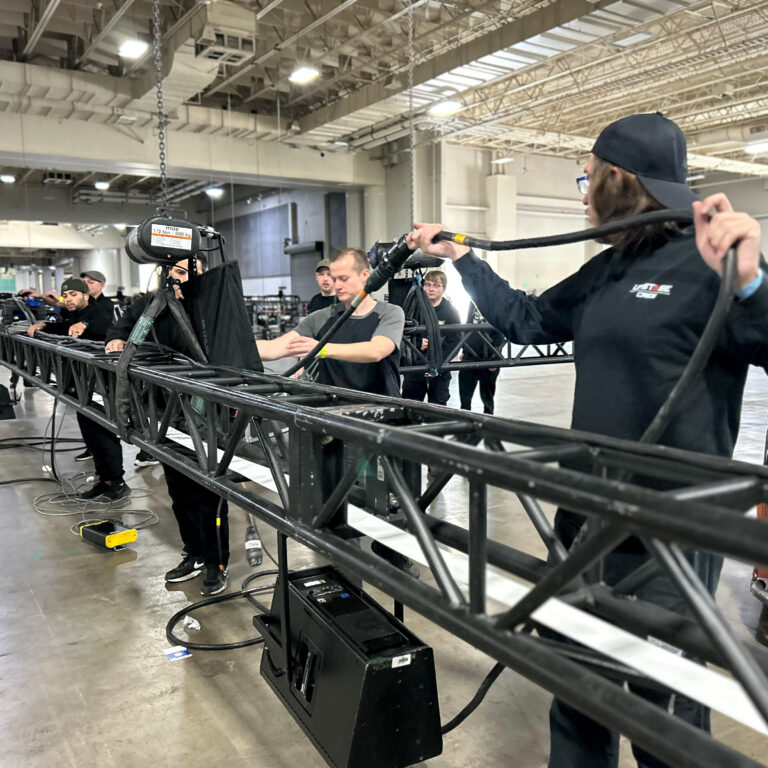 Upstage employees assembling stage equipment