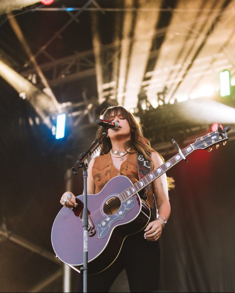 woman singing on stage