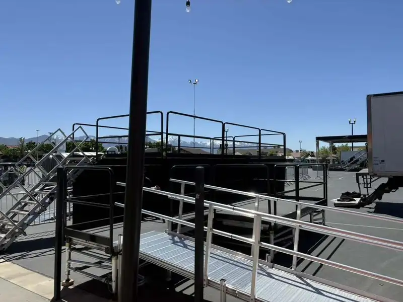 Upstage ADA platform with wheelchair ramp and safety railings