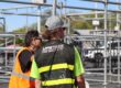 Upstage Companies crew lead Kelton Bass directing stage scaffolding build for stage production at Breakaway Utah
