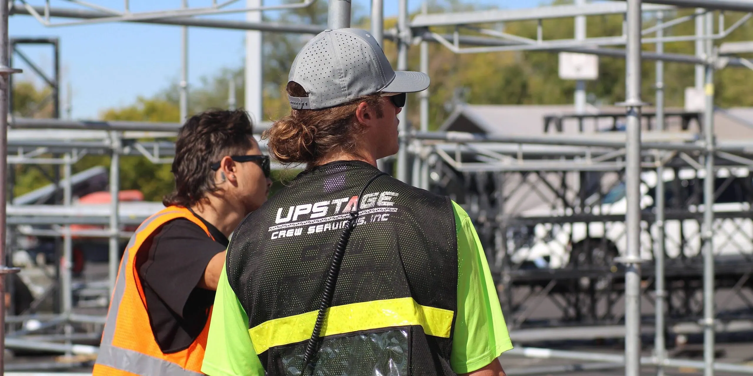 Upstage Companies crew lead Kelton Bass directing stage scaffolding build for stage production at Breakaway Utah
